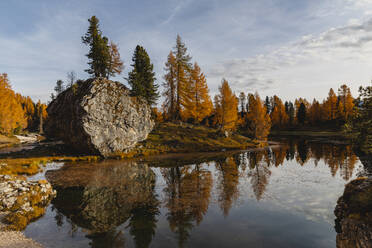 Autumnal mountain landscape reflected in the lake, Dolomites, Cortina, Italy - MRAF00444