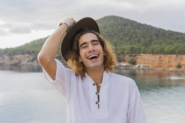 Portrait of laughing young man, Ibiza, Balearic Islands, Spain - AFVF04252