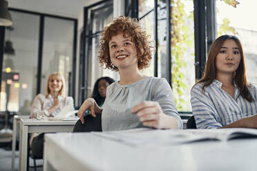 Businesswomen attending a workshop in conference room - ZEDF02726