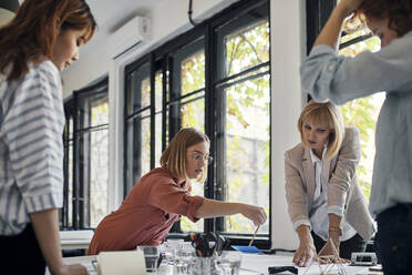 Businesswomen having a meeting in office - ZEDF02759