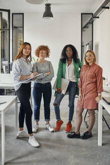 Portrait of confident female business team in office - ZEDF02817
