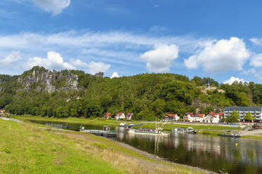 Germany, Saxony, Rathen, Tourboat on Elbe river with Bastei rock formation in background - FRF00895