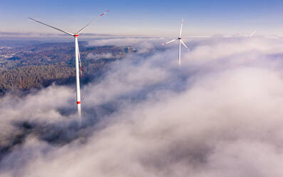 Germany, Baden-Wurttemberg, Goldboden, Wind farm shrouded in autumn fog - STSF02365
