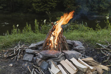 Campfire burning in stone circle - GWF06306