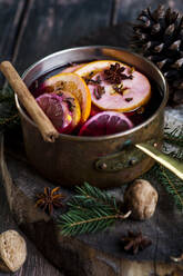 Mulled wine with oranges and cinnamon in a saucepan - SBDF04142