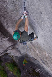 Rock climber on The Daily Planet route on The Chief in Squamish, Canada - ISF23155