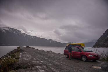 Man on canoe trip in Squamish River, Howe Sound, Canada - ISF23157