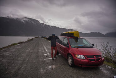 Man on canoe trip in Squamish River, Howe Sound, Canada - ISF23158