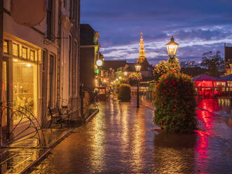 City view at dusk with illuminated tower of the townhall, Zierikzee, Netherlands - LAF02438