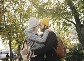 Young couple embracing in a city park, Berlin, Germany - AHSF01464