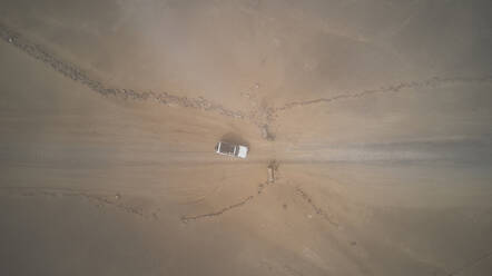 Drone view of a 4x4 in the foggy desert, Namibia - VEGF00906