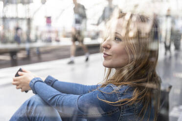 Woman waiting at the train station, Berlin, Germany - WPEF02332