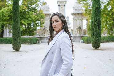 Portrait of a woman standing in a park - KIJF02830