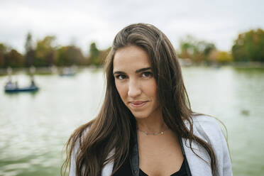 Portrait of a woman at a lake - KIJF02835