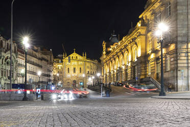 Portugal, Porto District, Porto, Vehicle light trails in front of Sao Bento railway station at night - WPEF02388