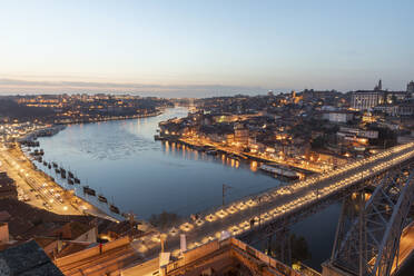 Portugal, Porto District, Porto, Aerial view of illuminated Dom Luis I Bridge at dusk - WPEF02406