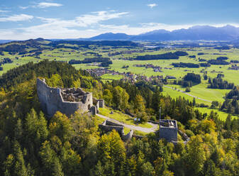 Germany, Bavaria, Eisenberg, Aerial view of ruins of Eisenberg Castle standing on top of forested hill - SIEF09356