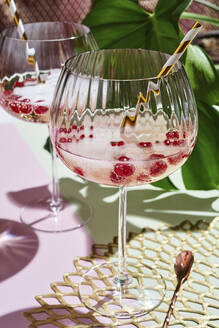 Glass of champagne with fresh berries - DREF00001