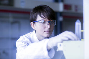 Female laboratory technician working in a laboratory - SGF02458