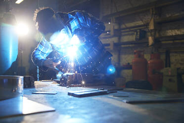 Metal worker working in workshop - PMF00925