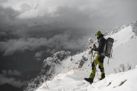 Mountaineer hiking, Italian Alps, Lecco, Lombardy, Italy stock photo