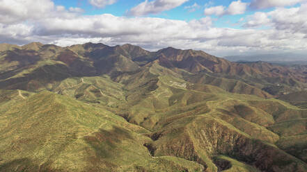 Aerial view of colourful mountains with many trees in Marbella, Spain - AAEF05691