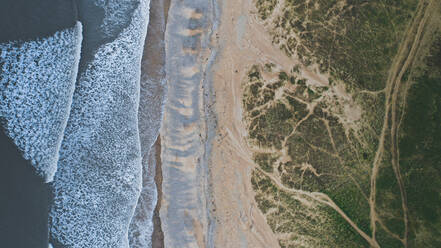 Aerial view of beautiful beach with green sanddunes near Ogmore-by-Sea, Wales. - AAEF05701
