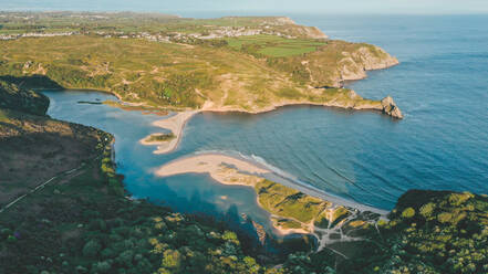 Aerial view of colourful coast and Three Cliffs Bay with beautiful sunlight in near Nichelaston, Wales - AAEF05706