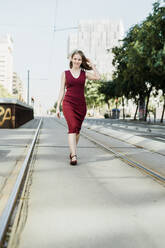 Portrait of a girl walking around the city of Barcelona - CAVF69508