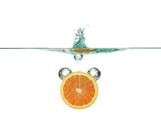 Orange slice in water against white background - CAVF69711
