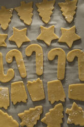 High angle view of Christmas cookies arranged on cloth - CAVF69723