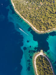 Aerial view of boat sailing at strait between Koludarc island, Croatia. - AAEF05980