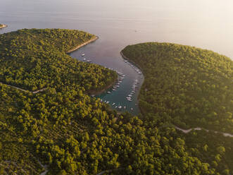 Aerial view of boats anchored at the shore of Krivica, Croatia. - AAEF05986