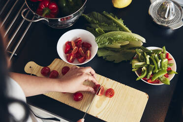 Woman preparing healthy food in kitchen - JOHF04695