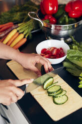 Woman preparing healthy food in kitchen - JOHF04705