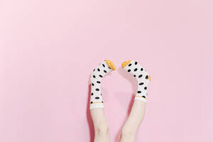 Legs of a girl wearing dotted socks - ERRF02291