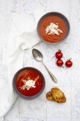 Two bowls of vegan tomato soup with coconut flakes - LVF08462