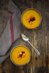 Two bowls of pumpkin-sweet potato soup with corn and kidney beans - LVF08466