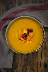 Bowl of pumpkin-sweet potato soup with corn and kidney beans - LVF08469