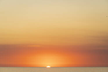 USA, California, Los Angeles, Moody orange sky over Pacific Ocean at sunset - SEEF00062