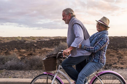 Happy active senior couple on bicycle, Tenerife - SIPF02092