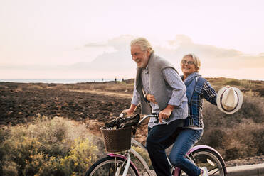 Happy active senior couple on bicycle, Tenerife - SIPF02095