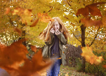 Beautiful Red Haired Girls in Falling Autumn Leaves - CAVF70009