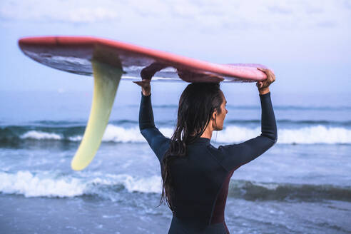 Water women friends surfing together at sunset - CAVF70248