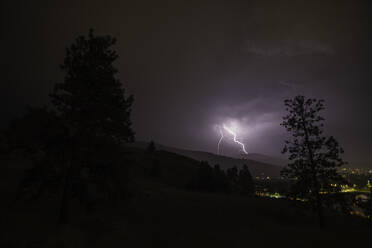 Lightning bolts during thunderstorm over Okanagan Valley, British Columbia, Canada - CUF53671