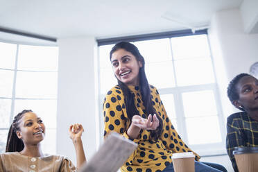 Happy businesswoman talking in conference room meeting - HOXF04715