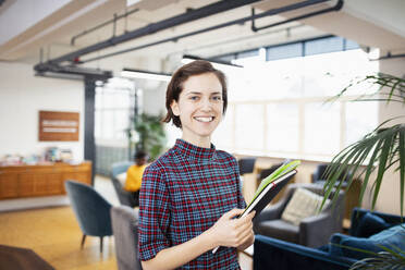 Portrait confident businesswoman in office - HOXF04809