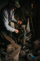 Old worker in the blacksmith - CAVF70523