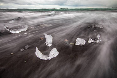 Chunks of ice resembling diamonds, Jokulsarlon beach (Diamond beach), Iceland - CUF53961