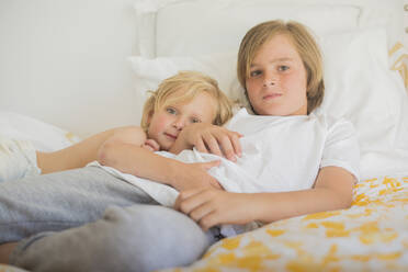 Brothers resting in bed - CUF54141